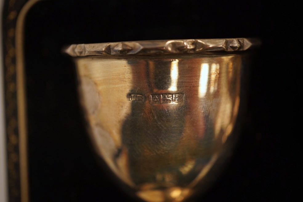 A late Victorian demi-fluted cream jug and sugar bowl, Charles Stuart Harris, London, 1888, together with cased silver christening egg cup, spoon and napkin ring and two other silver napkin rings.